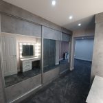 Grey and mirror sliding door robes